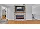 Modern fireplace with a stone surround and electric insert at 2330 Peterson Rd, Lakeland, FL 33812