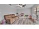 Bright living room features hard surface floors, fresh paint, and abundant natural light at 2330 Peterson Rd, Lakeland, FL 33812