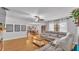 Open living room with hardwood floors offers great flow into dining area at 2330 Peterson Rd, Lakeland, FL 33812