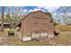 This backyard shed is perfect for storage and includes ramped door and utility cart at 2330 Peterson Rd, Lakeland, FL 33812