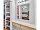 Convenient storage solution featuring custom shelving, enhancing organization in the bedroom suite at 2330 Peterson Rd, Lakeland, FL 33812