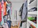 Open walk-in closet is spacious with organizers for clothes at 2330 Peterson Rd, Lakeland, FL 33812