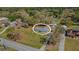 Aerial view of home on a large lot with mature trees; great for a Gathering or someone that enjoys nature at 2465 Thornhill Rd, Auburndale, FL 33823