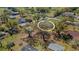 A landscape aerial showing a lot with mature trees at 2465 Thornhill Rd, Auburndale, FL 33823