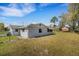 Large backyard with mature trees providing shade and privacy at 2465 Thornhill Rd, Auburndale, FL 33823