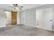 Bedroom boasts carpeted floors and a barn door to closet at 2465 Thornhill Rd, Auburndale, FL 33823