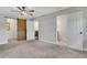 Main bedroom with carpet, rustic barn door to closet, and ensuite bathroom at 2465 Thornhill Rd, Auburndale, FL 33823