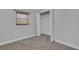 Neutral bedroom features carpet, closet and window with natural shade at 2465 Thornhill Rd, Auburndale, FL 33823