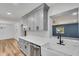 Kitchen featuring a large island, gray cabinetry, and a farmhouse sink at 2465 Thornhill Rd, Auburndale, FL 33823