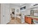 Relaxing bathroom includes a soaking tub, vanity, and tiled floors at 2726 Greyhawk Estates Ln, Lakeland, FL 33812