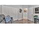 Bedroom featuring a leather sofa, wood floors, closet and a view into the hallway at 2726 Greyhawk Estates Ln, Lakeland, FL 33812