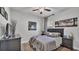 Cozy bedroom with a ceiling fan, a queen-sized bed, and two matching nightstands at 2726 Greyhawk Estates Ln, Lakeland, FL 33812