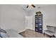 Bedroom showcasing a daybed with views into an open doorway and a bookcase at 2726 Greyhawk Estates Ln, Lakeland, FL 33812