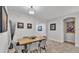 Cozy dining area featuring a wooden table, comfortable seating, and decorative wall art at 2726 Greyhawk Estates Ln, Lakeland, FL 33812