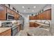 Elegant kitchen with stainless steel appliances, granite counters, and ample cabinet storage at 2726 Greyhawk Estates Ln, Lakeland, FL 33812