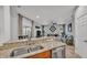 Modern kitchen with breakfast bar that opens to living room, perfect for entertaining guests at 2726 Greyhawk Estates Ln, Lakeland, FL 33812