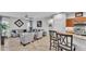 Open-concept space with living room adjacent to the breakfast bar and lovely interior design at 2726 Greyhawk Estates Ln, Lakeland, FL 33812