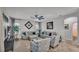 Spacious living room featuring neutral paint, ceiling fan and plenty of natural light at 2726 Greyhawk Estates Ln, Lakeland, FL 33812