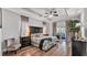 Elegant main bedroom with tray ceiling, wood floors, and sliding glass doors to the outside at 2726 Greyhawk Estates Ln, Lakeland, FL 33812