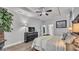 Well-lit main bedroom showcases a tray ceiling, ceiling fan, and large closet at 2726 Greyhawk Estates Ln, Lakeland, FL 33812