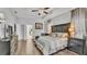 Well-designed main bedroom with wood flooring, tray ceiling, and en-suite bathroom at 2726 Greyhawk Estates Ln, Lakeland, FL 33812