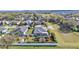 An aerial view of a home featuring a screened-in pool and a neatly maintained backyard at 2726 Greyhawk Estates Ln, Lakeland, FL 33812