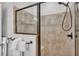 Enclosed tiled shower area with showerhead and seating at 2726 Greyhawk Estates Ln, Lakeland, FL 33812