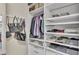 Detailed view of a walk-in closet with shelves and rods for clothes and accessories at 2726 Greyhawk Estates Ln, Lakeland, FL 33812