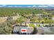 Aerial view of home highlighting the community and nearby citrus groves in a serene setting at 29 Buck Cir, Haines City, FL 33844