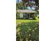 Cozy backyard area featuring a screen room, providing a perfect spot for relaxation at 29 Buck Cir, Haines City, FL 33844