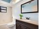 Bathroom featuring a shower/tub combination, vanity, and natural light from a skylight at 29 Buck Cir, Haines City, FL 33844