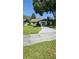Charming single-story home featuring a well-manicured lawn and a spacious driveway at 29 Buck Cir, Haines City, FL 33844
