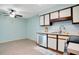 Charming kitchen featuring bright white cabinets, modern appliances and lots of natural light at 29 Buck Cir, Haines City, FL 33844