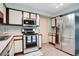 Well-maintained kitchen featuring stainless steel appliances, ample counter space, and classic white cabinetry at 29 Buck Cir, Haines City, FL 33844