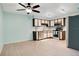 Open kitchen featuring updated stainless steel appliances and stylish cabinetry for ample storage at 29 Buck Cir, Haines City, FL 33844