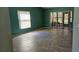 Inviting living room featuring neutral paint, tile flooring, and a bright sliding glass door with an adjacent window at 29 Buck Cir, Haines City, FL 33844