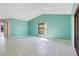 Bright, spacious living room with tile flooring and ample natural light showcases a neutral color palette at 29 Buck Cir, Haines City, FL 33844