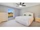 Cozy bedroom with neutral carpet and white furniture creates a serene and relaxing atmosphere at 29 Buck Cir, Haines City, FL 33844