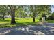 Scenic neighborhood featuring lush green spaces and mature trees, creating a serene setting at 29 Buck Cir, Haines City, FL 33844