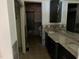 Bathroom with tile, double sinks and a granite countertop at 330 Callitris Ave, Polk City, FL 33868