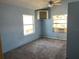 Bedroom featuring carpet and a window AC unit at 330 Callitris Ave, Polk City, FL 33868