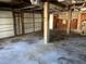 Unfinished garage with concrete floor and exposed ceiling, ready for customization and storage at 330 Callitris Ave, Polk City, FL 33868