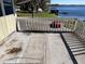 Waterfront patio with railing overlooking the lake at 330 Callitris Ave, Polk City, FL 33868