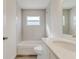 Updated bathroom featuring subway tile walls, stone countertop, and a bathtub-shower combo at 3815 Horizon View Loop, Lakeland, FL 33813