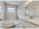 Updated bathroom featuring subway tile, stone countertop, and a shower-tub combo at 3815 Horizon View Loop, Lakeland, FL 33813