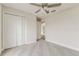 Bedroom featuring plush carpet, a ceiling fan, and a large closet at 3815 Horizon View Loop, Lakeland, FL 33813