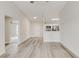 Open-concept living area with wood floors, a view into the kitchen, and a ceiling fan at 3815 Horizon View Loop, Lakeland, FL 33813