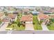 An aerial view of a home that features a terracotta roof, well manicured lawn, and a 3-car garage at 3965 Aquilla Dr, Lakeland, FL 33810