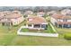 An aerial view of the back of a home with a patio, screened in porch, and white fence at 3965 Aquilla Dr, Lakeland, FL 33810