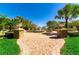 A community water fountain surrounded by palm trees, green grass, and landscaping at 3965 Aquilla Dr, Lakeland, FL 33810